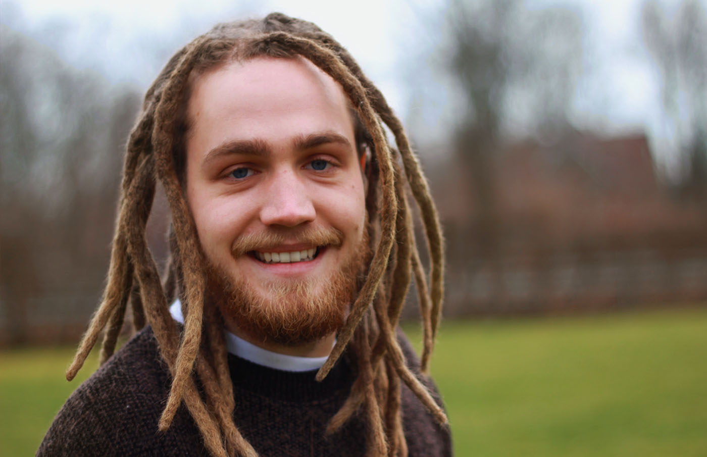 Dreadlocks rastaman with a big smile.