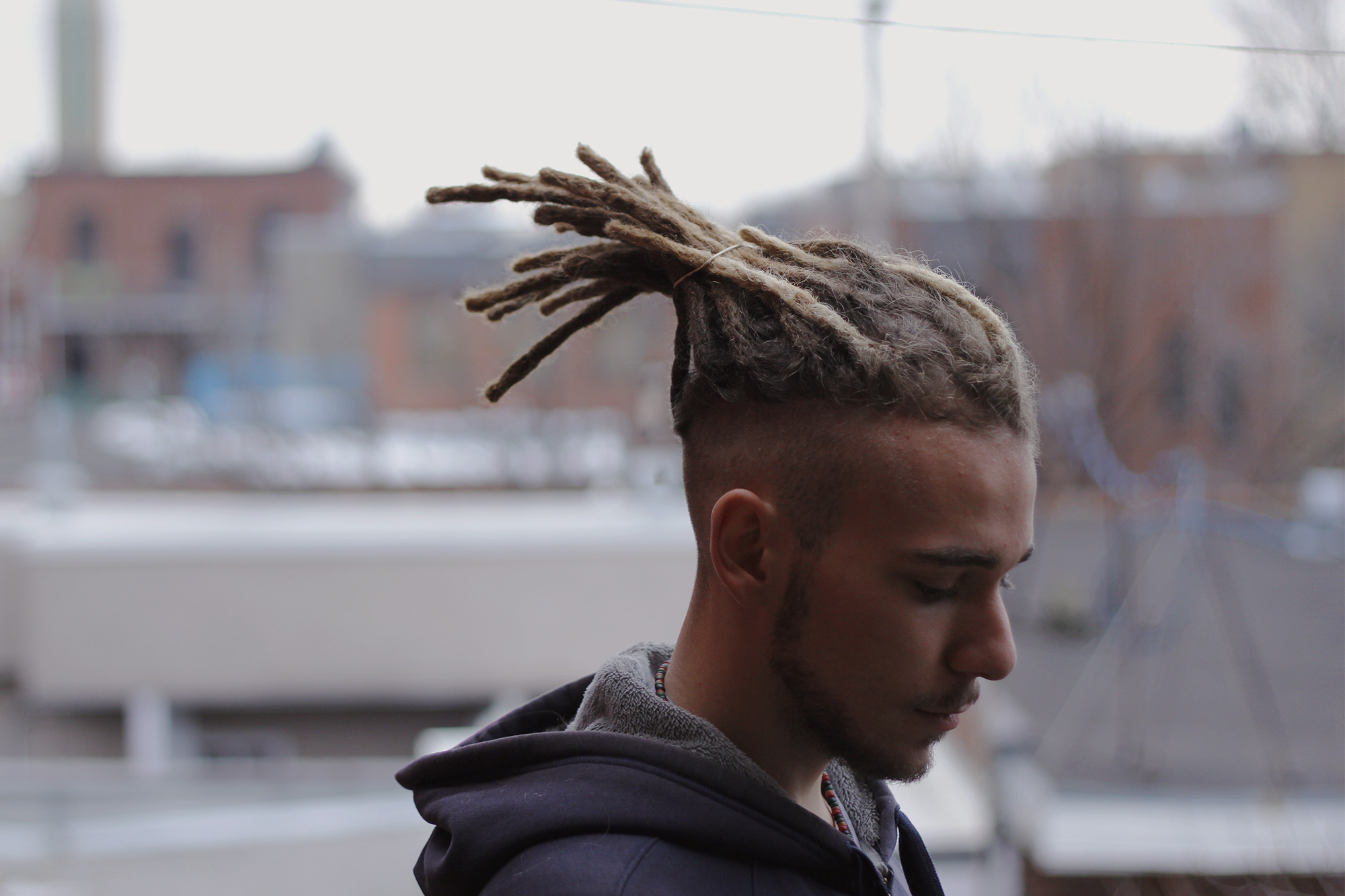 Nice Dreadlocks on a blond guy with shaved sides of his head.