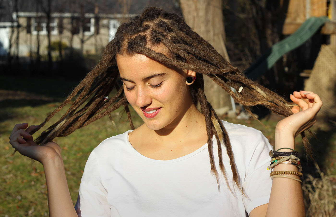 Serina with beautiful sexy dreadlocks holding her dreadlocks like a princess